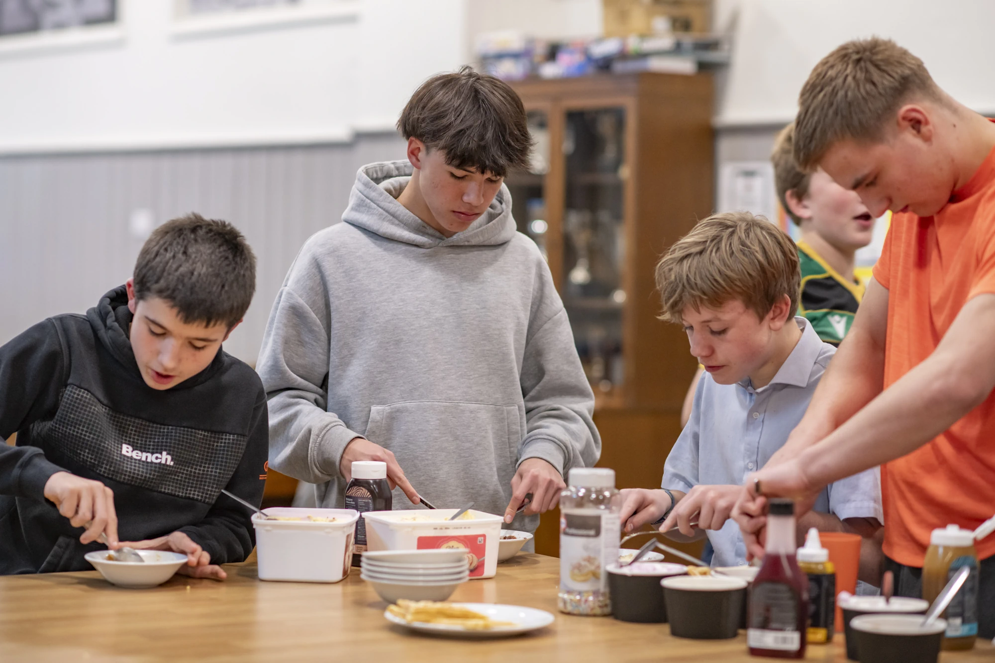 Barnard Castle School boarding pupils eating in the kitchen.