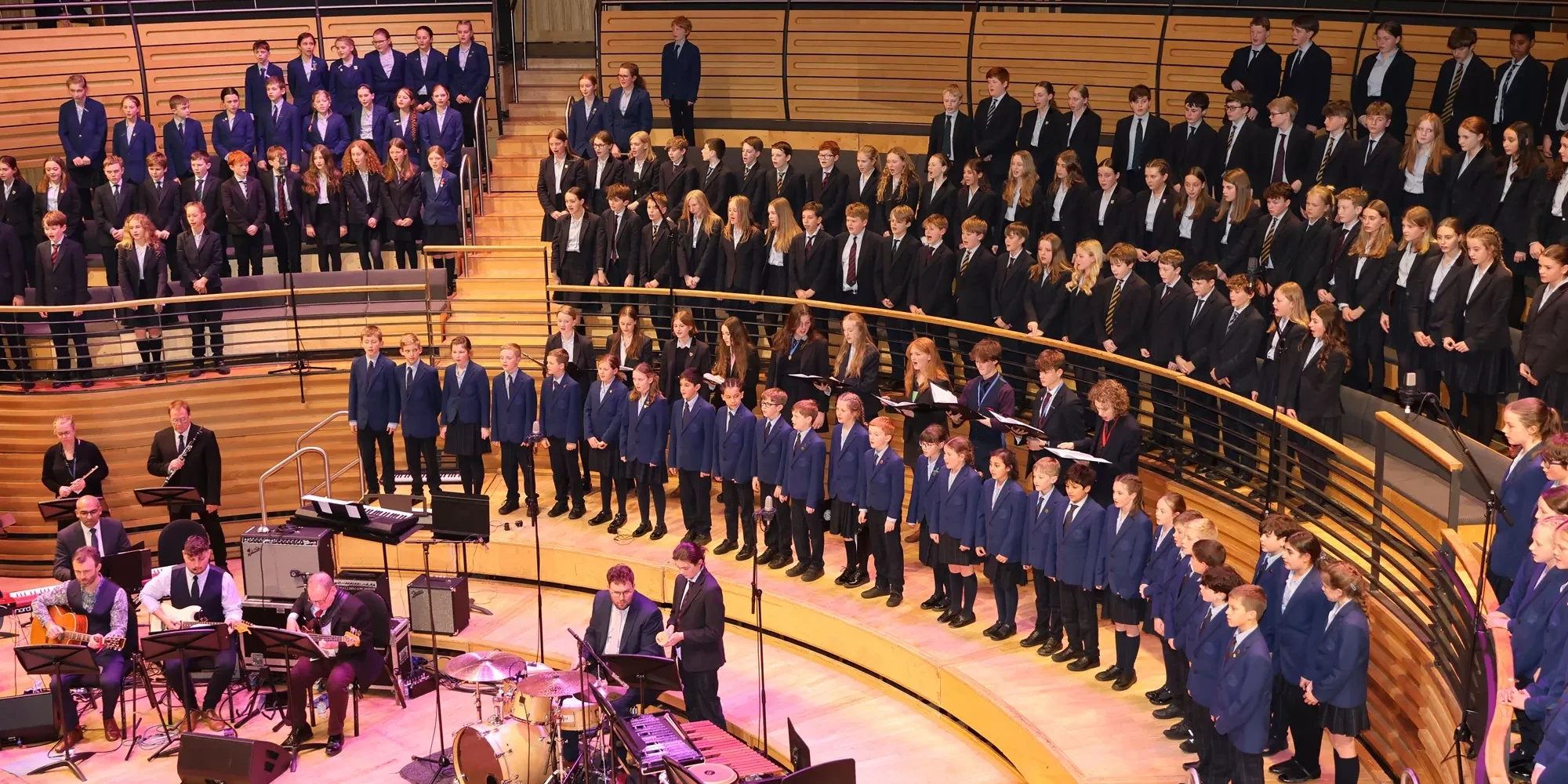 Barnard Castle School pupils singing in the glasshouse.