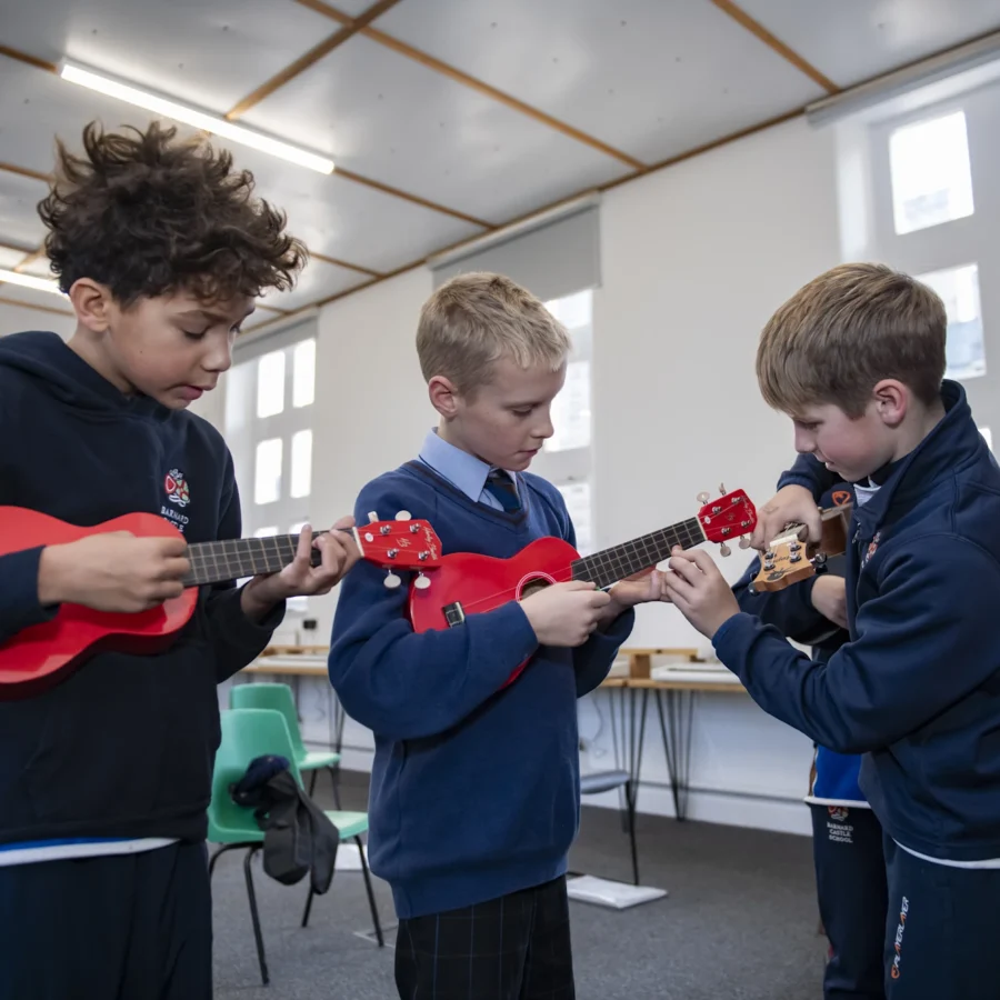 Barnard Castle School pupils learning how to play the ukelele.