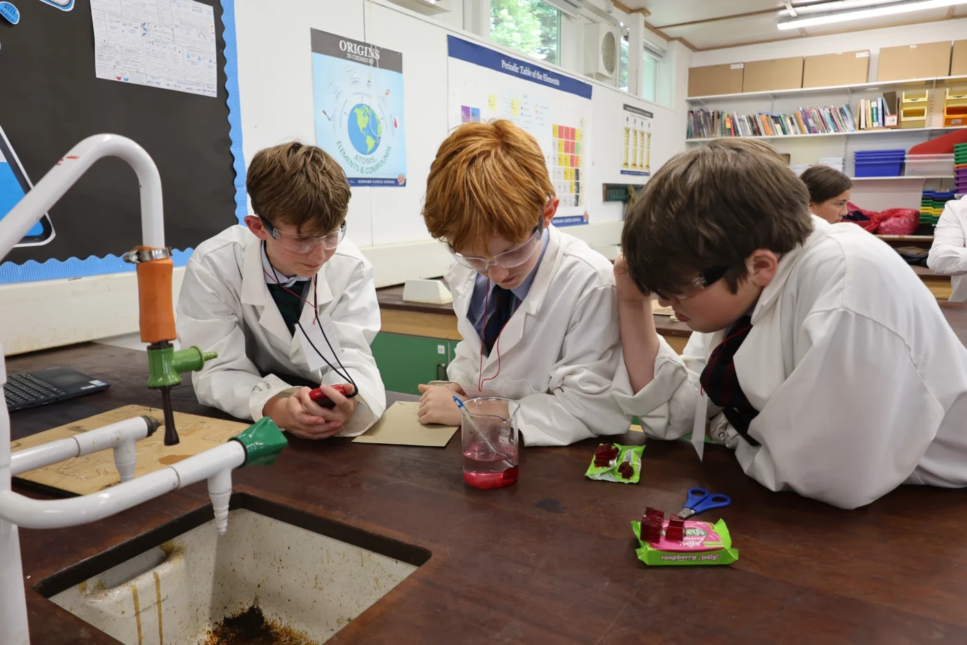 Three Senior School students in a science lesson.