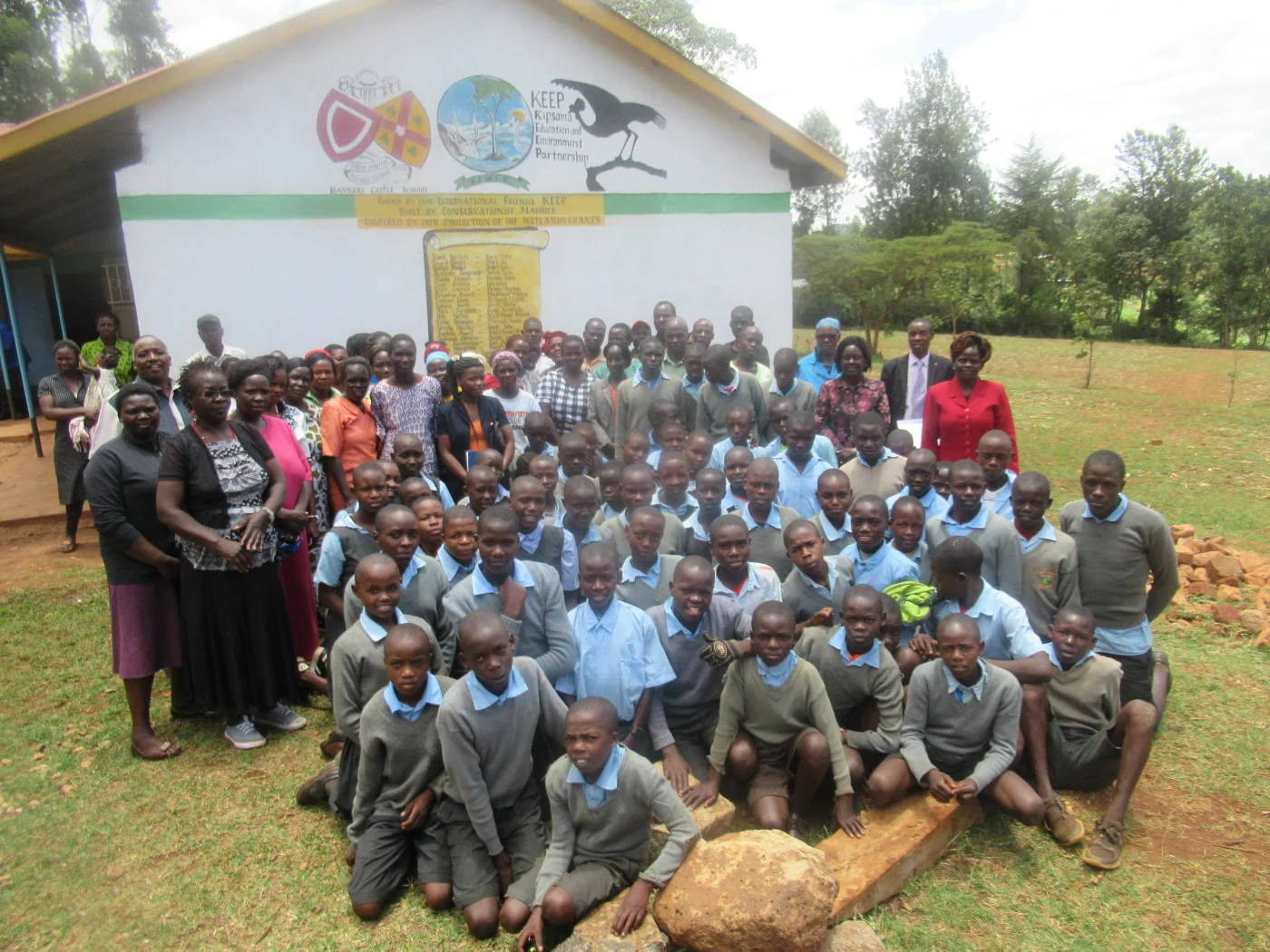 A large group of students and teachers from Kipsaina Village.